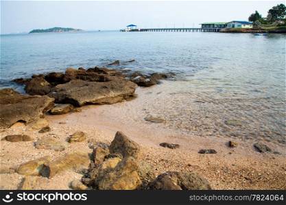 Beach and sea. The beaches of Koh Larn. Sand and sea with a ship moored in the calm sea.
