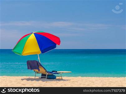 Beach and the sea bed, the bright blue canvas umbrellas and beautiful.