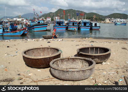 Beach and traditional fishing boats in Nha Trang, Vietnam