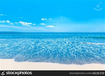 Beach and tropical sea. Beach and beautiful tropical sea under clear blue sky