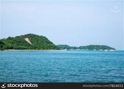 Beach attractions of Pattaya Koh Larn. Tree covered mountains of Koh Larn.