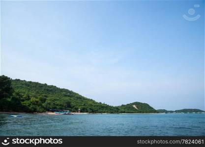 Beach attractions of Pattaya Koh Larn. Tree covered mountains of Koh Larn.