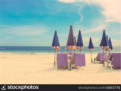 Beach chair and umbrella on tropical sand beach