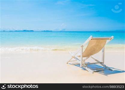 Beach chair on tropical beach sand