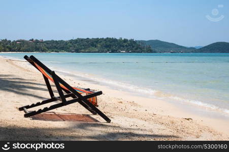 Beach chairs on idyllic tropical sand beach.