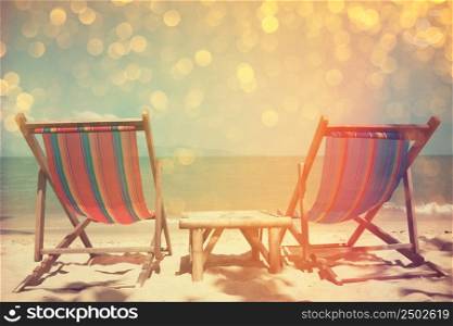 Beach chairs on sea shore with glowing bokeh and film stylized, double exposure effect