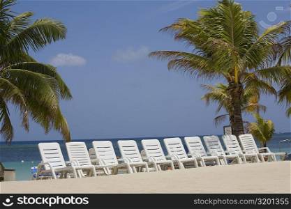 Beach chairs on the beach, Roatan, Bay Islands, Honduras