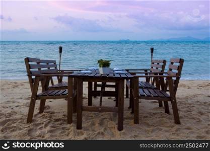 Beach dinner serving at sunset
