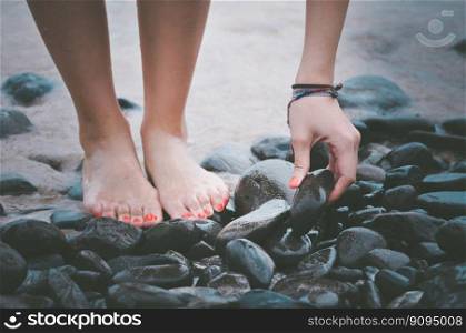 beach feet hand pebbles sand