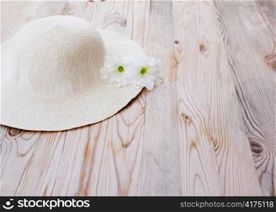 beach hat with white flower on clear woon