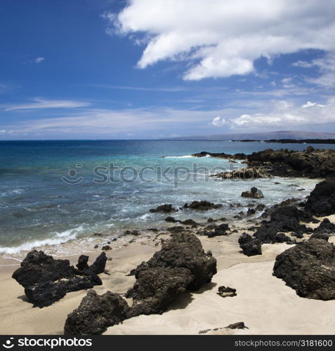 Beach in Maui, Hawaii with lava rocks.