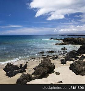 Beach in Maui, Hawaii with lava rocks.