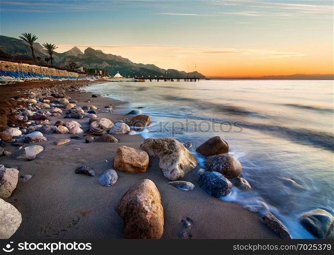Beach in Mediterranean sea at sunset, Turkey