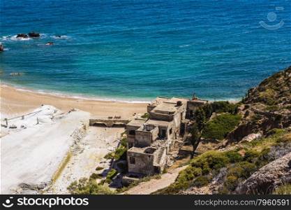 Beach near abandoned sulfur mines at Milos island, Cyclades, Greece