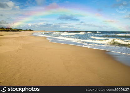 beach of Baltic Sea, Poland with rainbow
