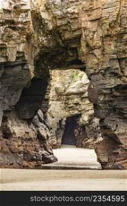 Beach of the Cathedrals, Playa las Catedrales in Ribadeo, province of Lugo, Galicia. Cliff formations on Cantabric coast in northern Spain. Tourist attraction.. Beach of the Cathedrals, Galicia Spain. Place to visit.