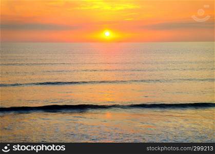 Beach of the ocean and golden sun rise. Bright beautiful background.