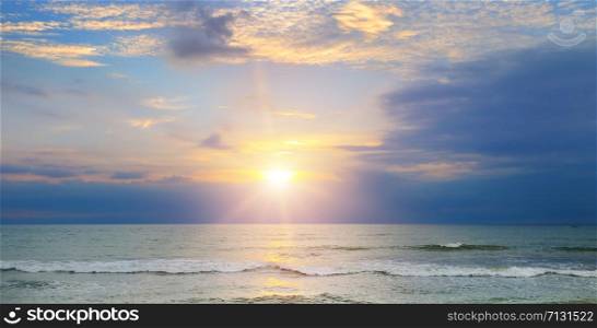 Beach of the sea and sunset. Bright beautiful background. Wide photo .