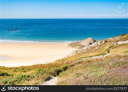Beach Pit on Breton coastline in France Frehel Cape region with its sand, rocks and moorland in summer.