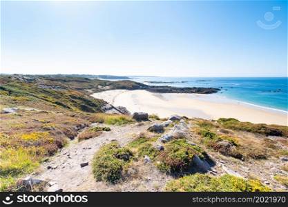 Beach Pit on Breton coastline in France Frehel Cape region with its sand, rocks and moorland in summer.
