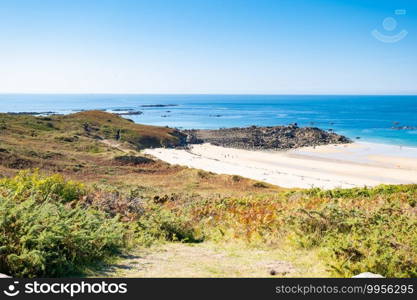 Beach Pit on Breton coastline in France Frehel Cape region with its sand, rocks and moorland in summer.