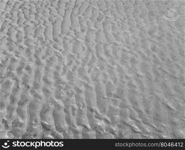 Beach sand background. Beach sand texture useful as a background in black and white