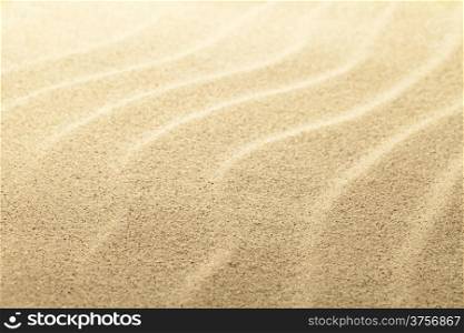 Beach sand background, sandy waves close up view