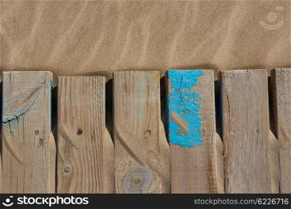 Beach sand texture with wood weathered stripes and old blue paint