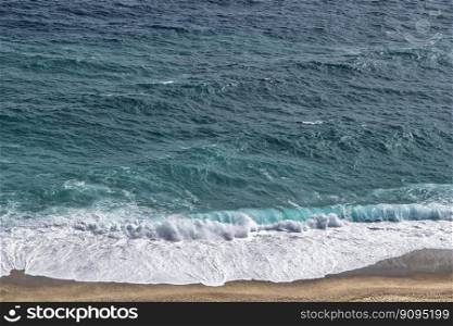 beach sand waves foam ocean sea