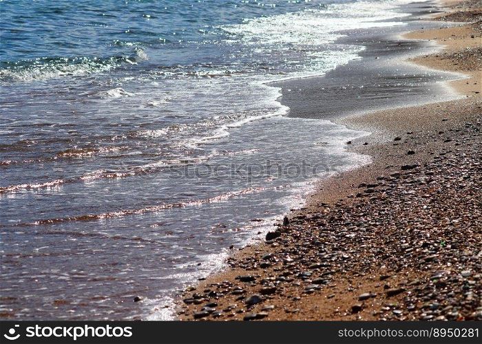 beach sea pebble beach waves water