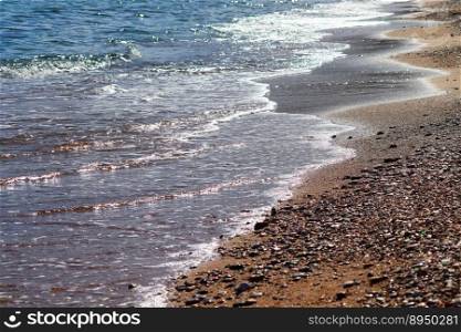 beach sea pebble beach waves water