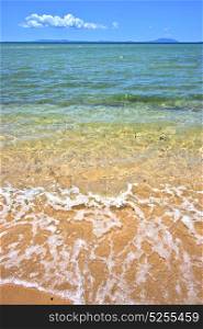 beach seaweed in indian ocean nosy be madagascar sand isle sky and foam