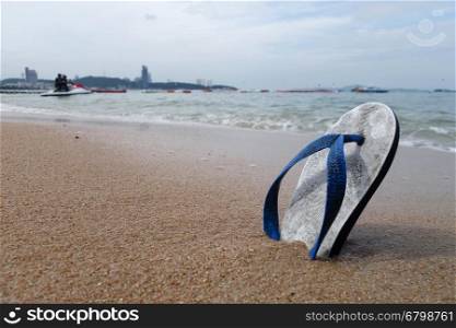 Beach slippers on a sandy beach in Pattaya, Thailand
