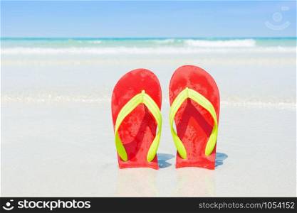 Beach, slippers on tropical beach in holiday at Thailand