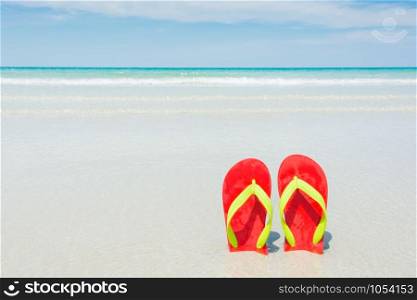 Beach, slippers on tropical beach in holiday at Thailand