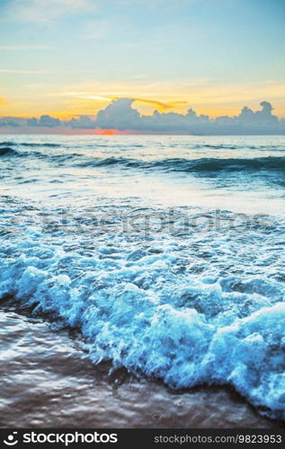 Beach sunrise or sunset over the tropical sea and sky with clouds. Beach sunset over the tropical sea