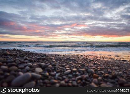beach sunset pebbles stones ocean
