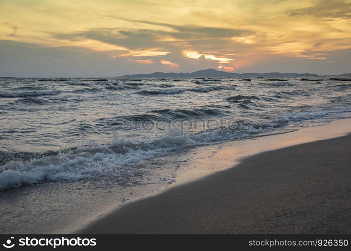 beach sunset silhouette islands beautiful beach sandy on the tropical sea summer colorful yellow sky mountain background