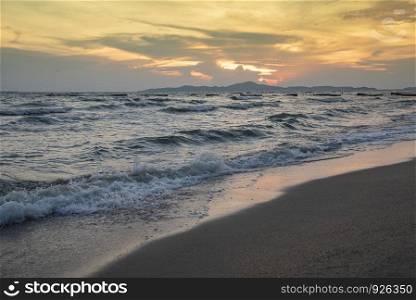 beach sunset silhouette islands beautiful beach sandy on the tropical sea summer colorful yellow sky mountain background