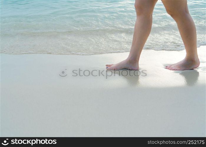 Beach travel - blur girl's walking on the white sand beach, vacation and relax - soft skin filter
