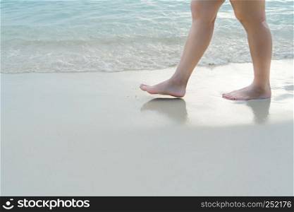 Beach travel - blur girl's walking on the white sand beach, vacation and relax - soft skin filter