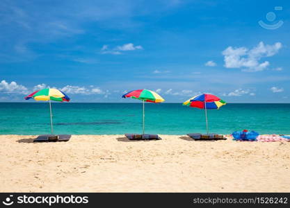 beach umbrella and ring on beach with blue sky, phuket thailand