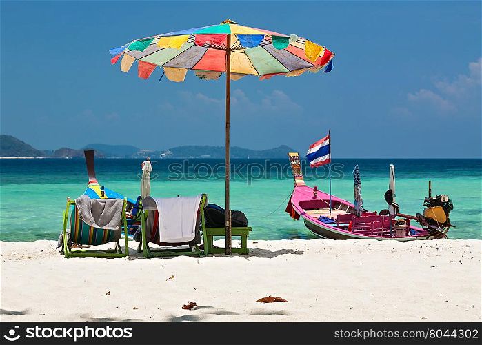 Beach umbrella in Komodo beach in Coral island, Thailand