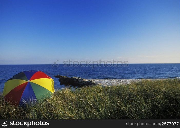 Beach umbrella on the beach, Cape Cod, Massachusetts, USA