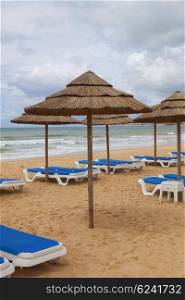 beach umbrellas at Algarve beach, Portugal