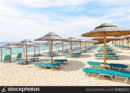 Beach umbrellas on sandy seashore