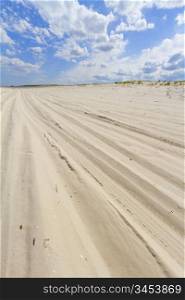 Beach view with car tire tracks in the sand, New Jersey shore