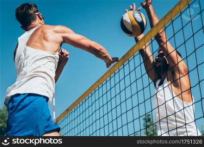 Beach volleyball detail - Males on the net
