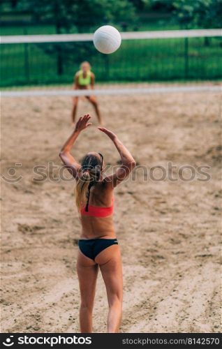 Beach Volleyball, Female Player Serving the Ball