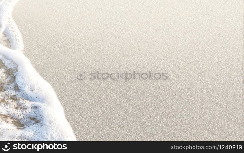 Beach wave on the white sand with copy space